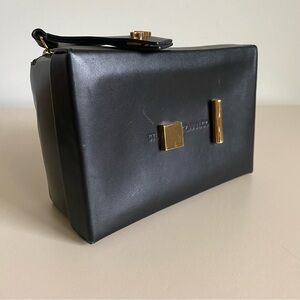 Stuart Weitzman “shoebox” Black Clutch with Gold hardware